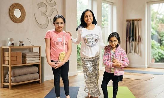 Children engaging in fun, playful yoga poses and balance exercises during a kids wellness class