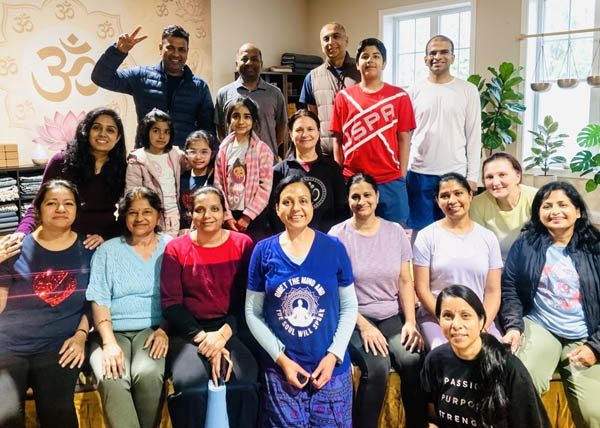 Leading a supportive group yoga class centered on holistic well-being and mind-body balance
