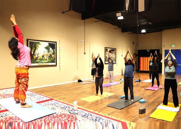 Providing personalized attention and supportive guidance during a local Bay Area yoga session
